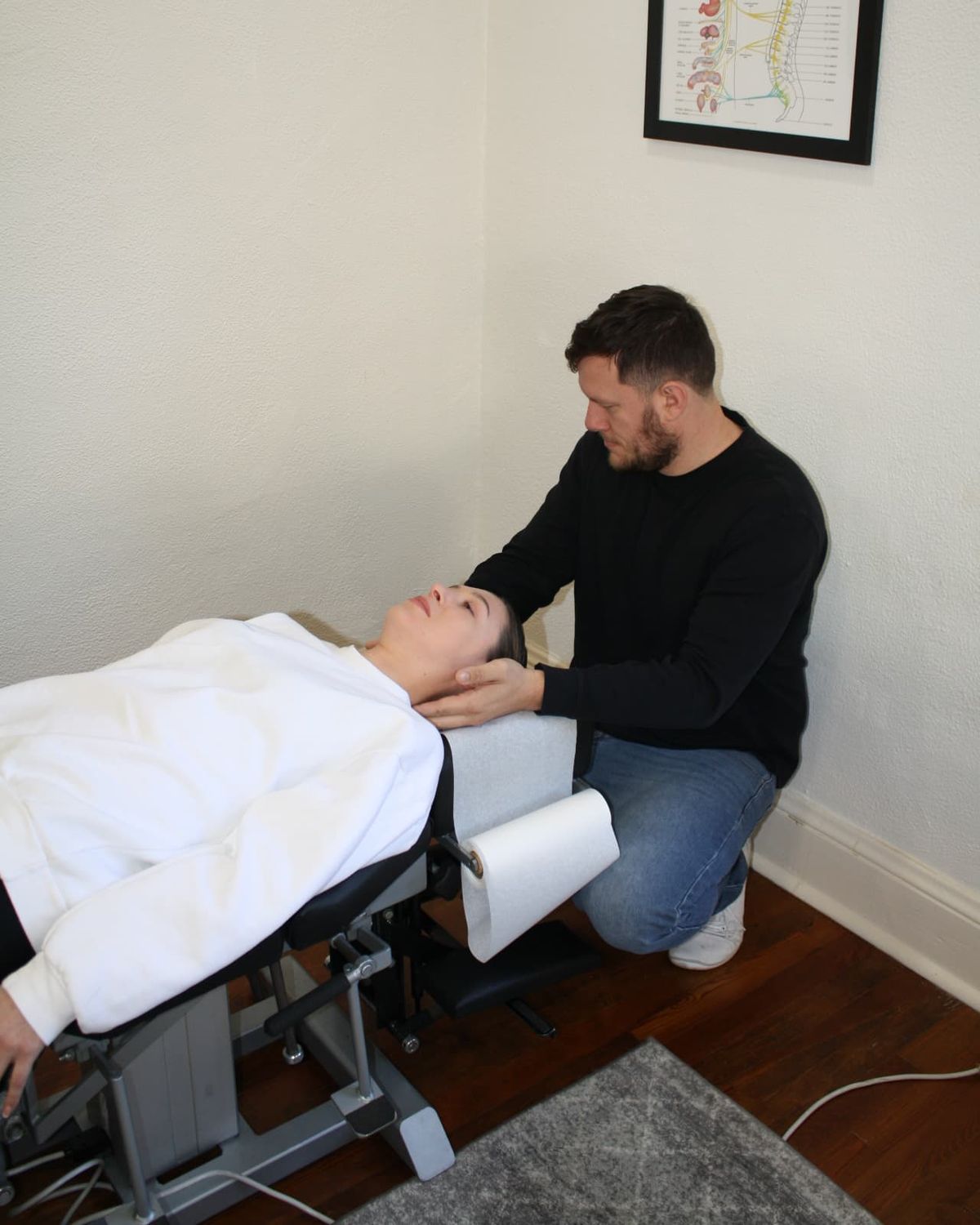 Dr. Scrimo delivering chiropractic adjustment in the Roswell clinic